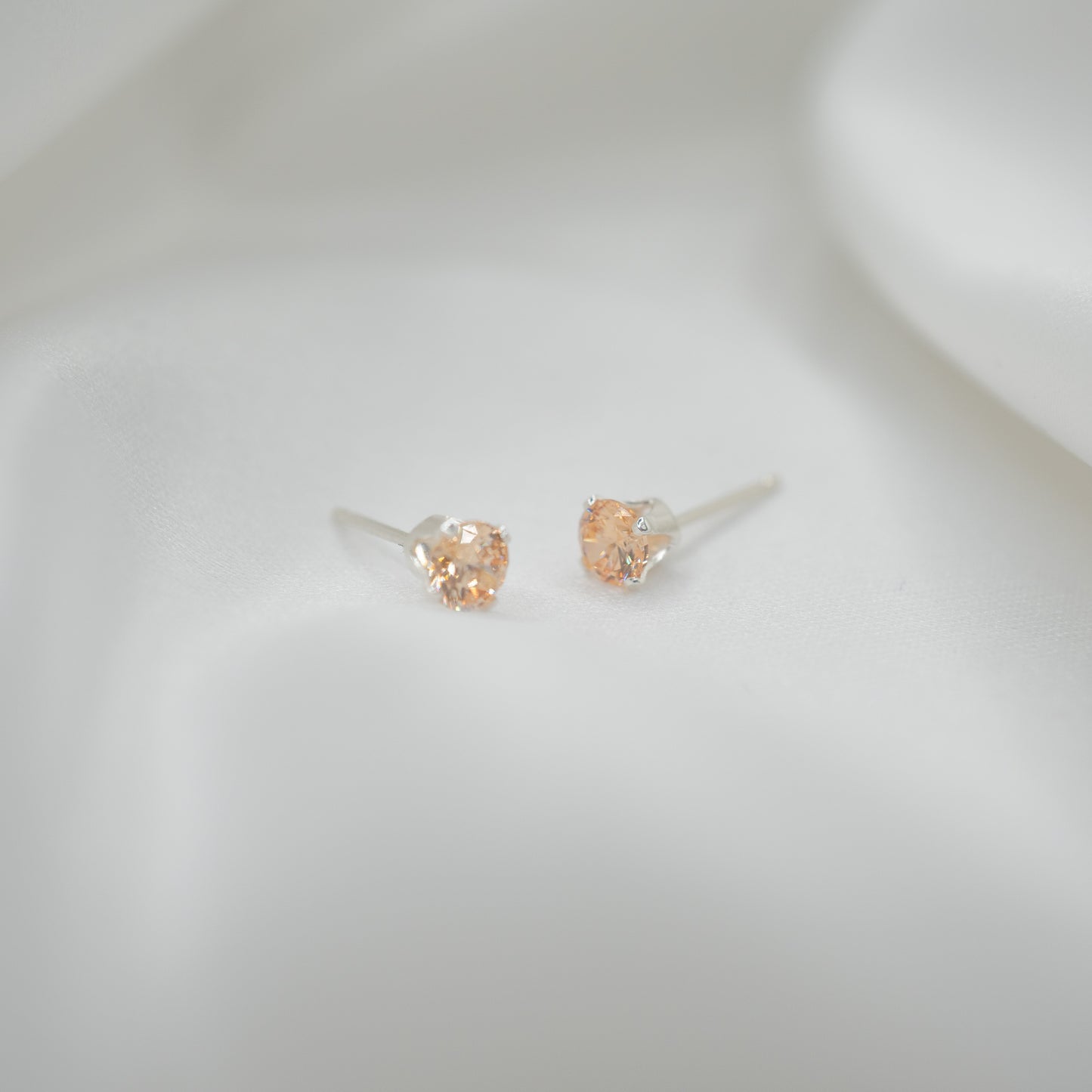 Sterling Silver Cubic Zirconia Studs - Various Sizes - front view - apricot 4mm