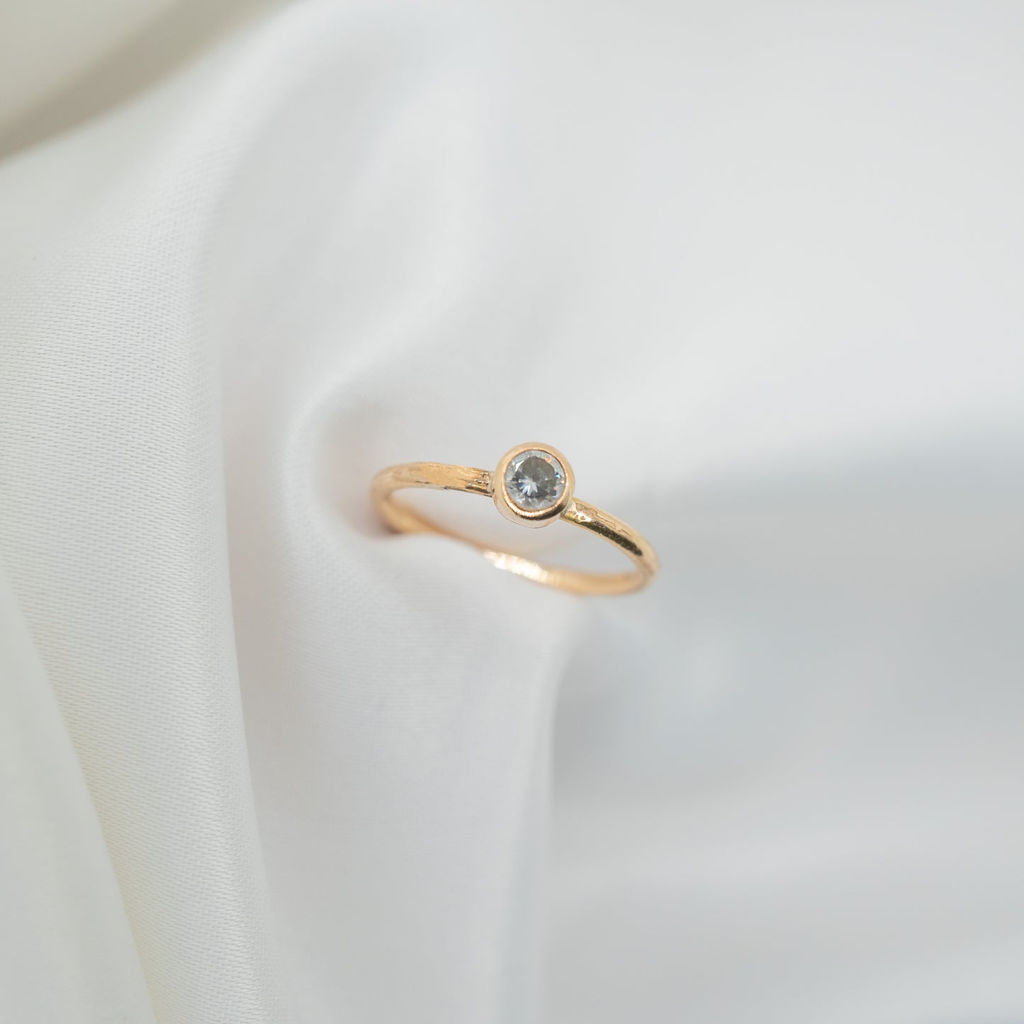 Gold Filled Cubic Zirconia Tube Ring - shot on white - aerial view