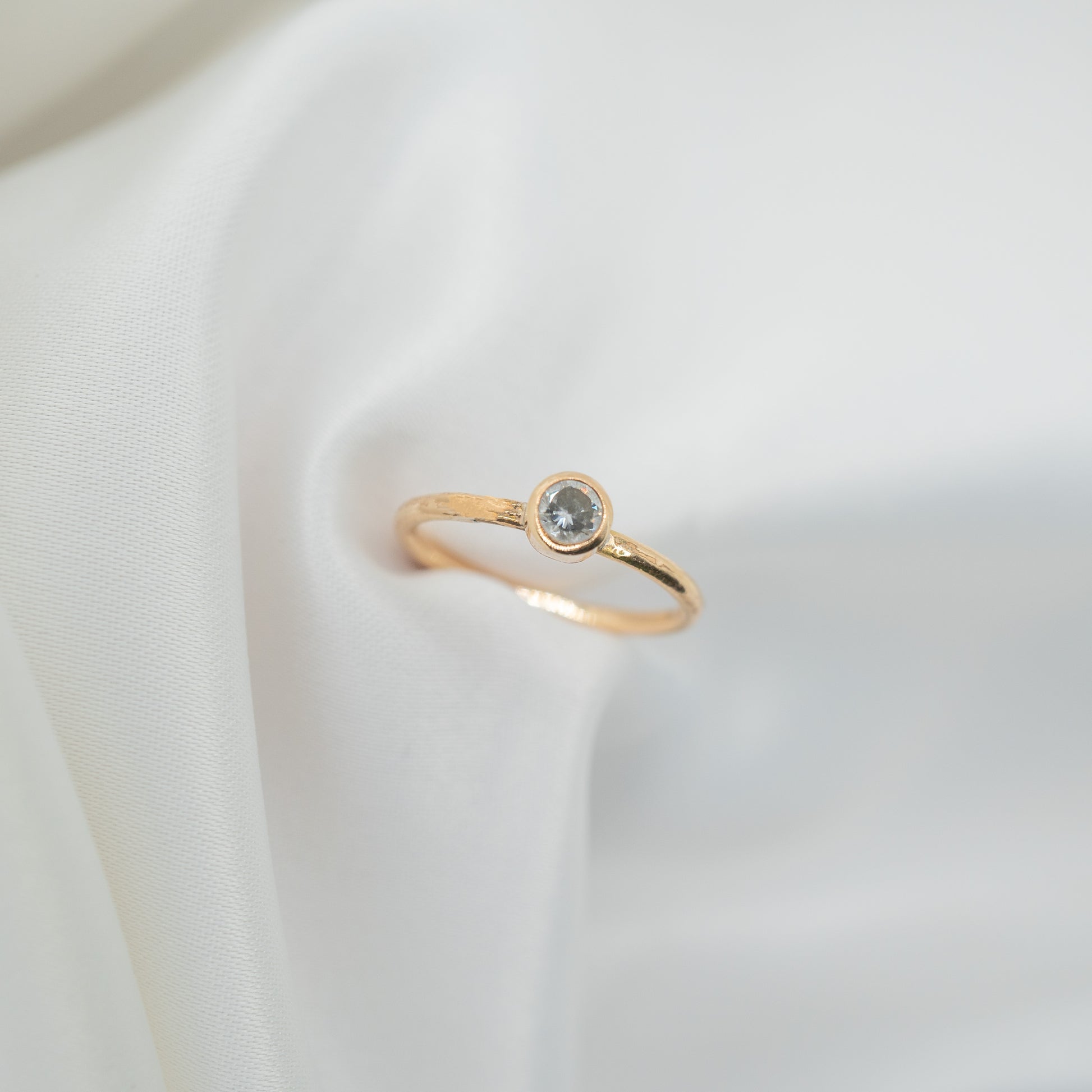 Gold Filled Cubic Zirconia Tube Ring - shot on white - aerial view