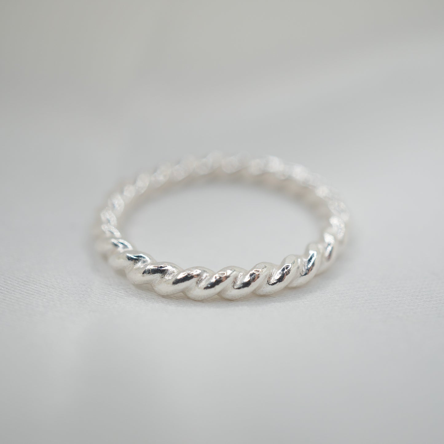 Sterling Silver Twisted Ring - shot on white - aerial view