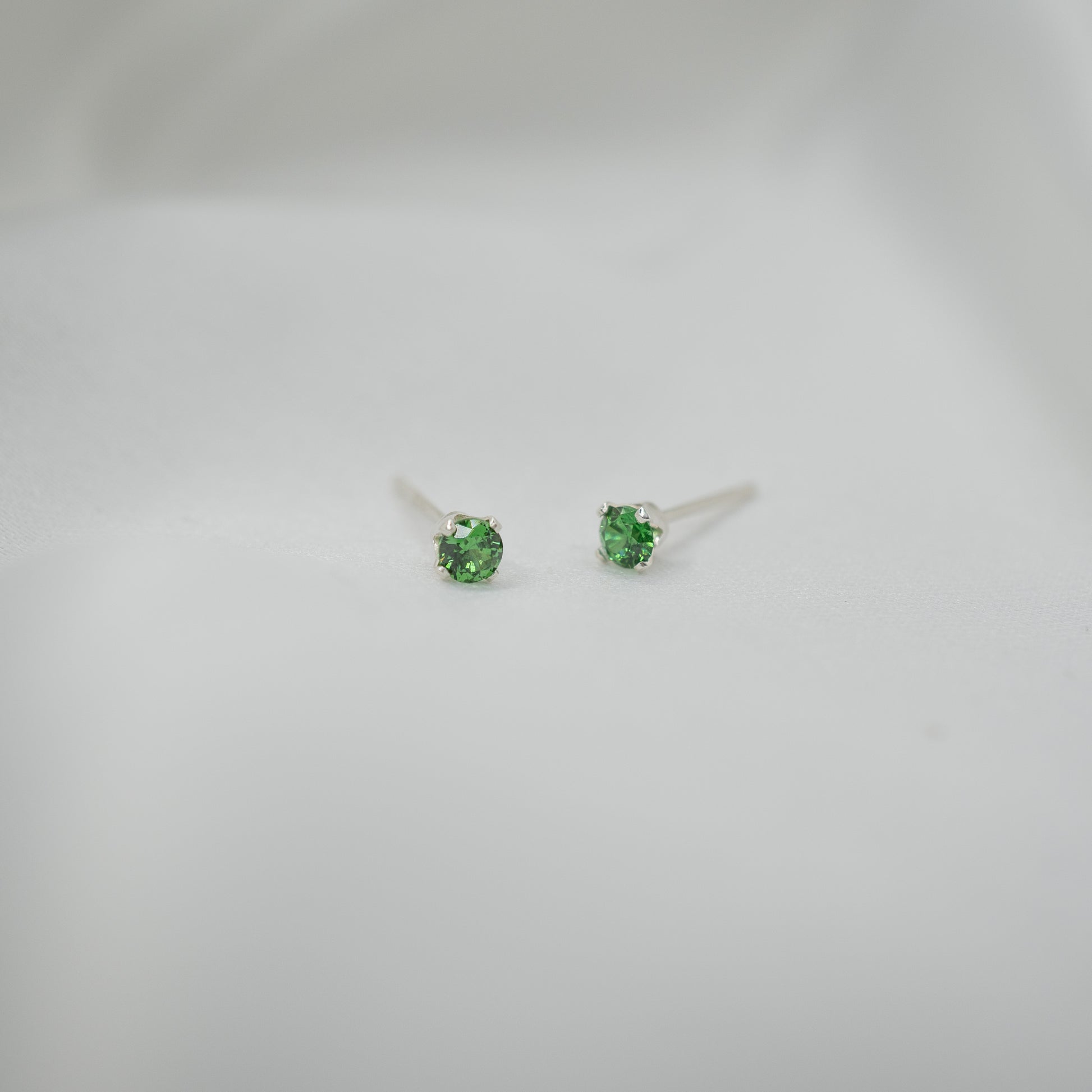 Sterling Silver Cubic Zirconia Studs - Various Sizes - front view - green 3mm